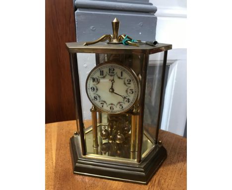 A 1966 German Kundo mantel clock, Enamelled and hand painted face, glass panelled and brass framed, comes with key. 