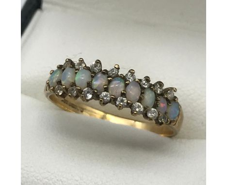 A Ladies 9ct gold opal and cz stone ring, ring size Q 1/2, Weighs 2.06 grams 