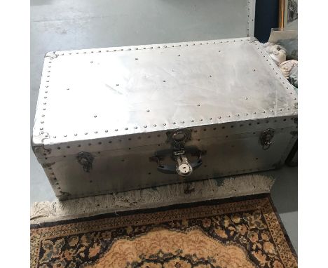 A Vintage metal travel trunk filled with a Queen Anne tea/dinner service and various odds 