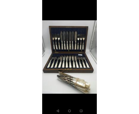 A boxed set of mother of pearl handled fish cutlery together with various other mother of pearl cutlery 