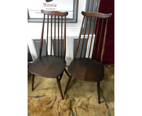 A Set of 4 Ercol elm wood spindle back chairs. 