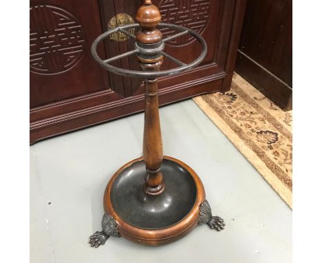 A Reproduction claw foot umbrella/ walking stick stand.
