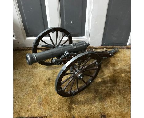 A Large scale military canon model, Made from wood, metal and plastic, Measures 69cm in length 