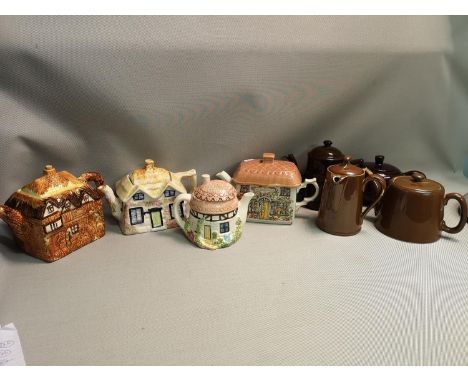 A selection of 8 teapots, some designed in the form of cottages, names include; Sadler, Price &amp; Royal Worcester 