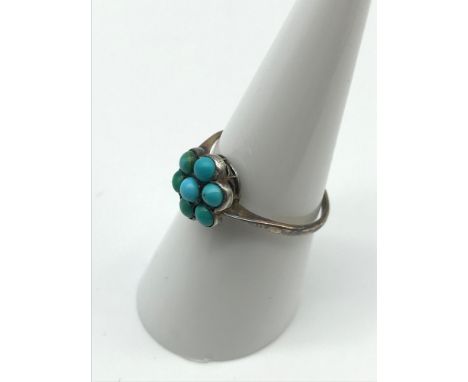 A Victorian 9ct gold ladies ring set with 7 Turquoise stones. Ring size N 1/2, Weighs 1.70grams 