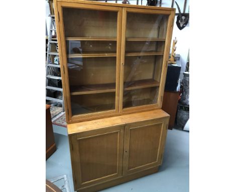 A Large Military/ School Bookcase unit, designed with two glass doors, fitted shelf interior &amp; under doors with fitted sh