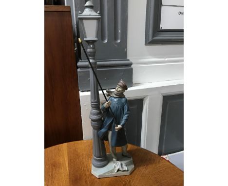 A Large Lladro 'Lamplighter' Figure, 5205 Man lighting gas lantern. Comes with original box, Measures 47cm in height 