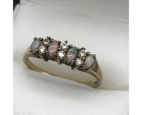 A Ladies 9ct gold, opal and cz stone ring, Ring size R, Weighs 1.86grams 