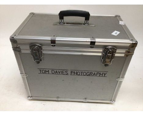 Lot of photographic accessories including light meters, viewing loupes, hoods and other items in an aluminium flight case
