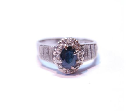 Diamond and sapphire oval cluster ring with eight-cut brilliants, in 18ct white gold, 1973, size O, 5.5g. 