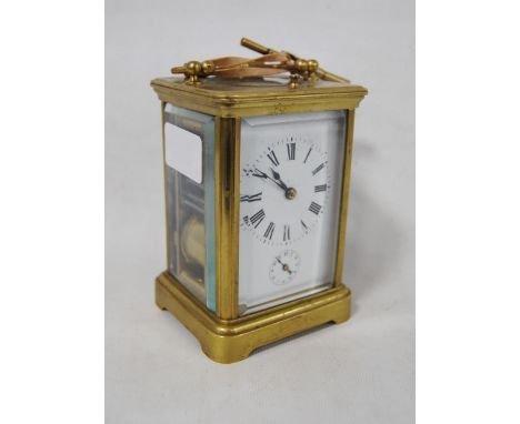 Brass repeater carriage clock with subsidiary seconds dial, with key, 12cm high.CONDITION REPORT: This is over wound and not 