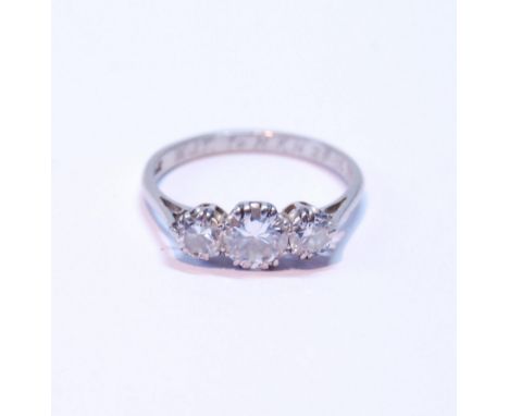 Diamond three-stone ring, the brilliants approximately .7ct and .4ct, in platinum, dated 1933, size O.CONDITION REPORT: VVS1 