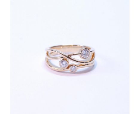 Diamond cross-over ring with brilliants in sizes, collet-set, approximately .08ct, .10ct and .3ct, in 18ct yellow gold, size 