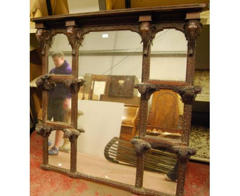 Antique Anglo-Indian padouk and hardwood overmantel mirror with four elephant head brackets above two sets of four repoussé-s