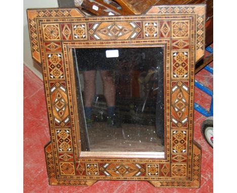 Antique Indo-Persian hardwood and marquetry inlaid wall mirror decorated all over with marquetry and mother of pearl lozenges