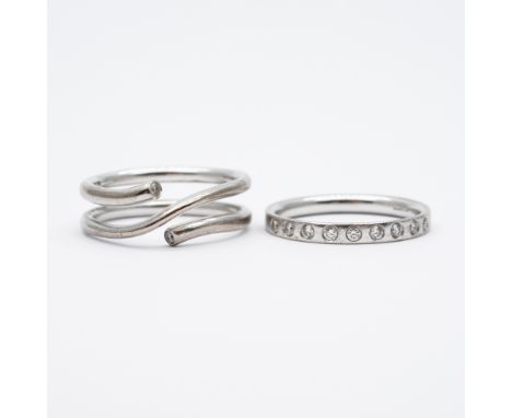 A pair of 18ct white gold Georg Jenson magic rings,
made from recycled 18ct gold,
size Q,
hallmarked Georg Jenson on the insi