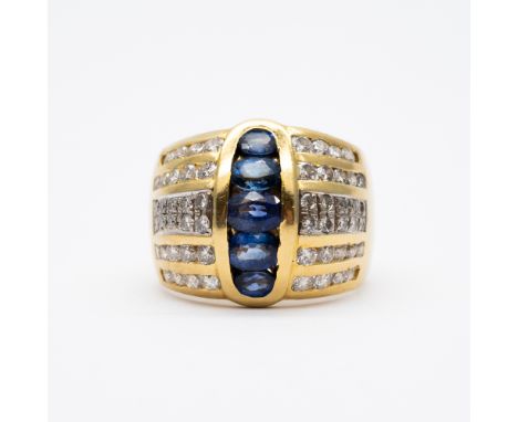 An 18ct yellow gold sapphire and diamond dress ring,
large ring,
20mm at largest and 20mm at the smallest,
size S,
15.2 grams