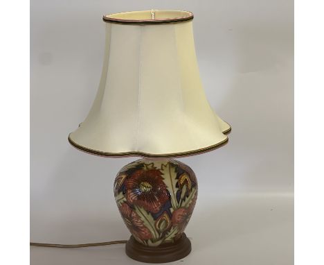 A Moorcroft lamp and shade, Moorcroft pottery pheasants eye pattern table lamp with Goldcrest handmade silk lamp shade, both 