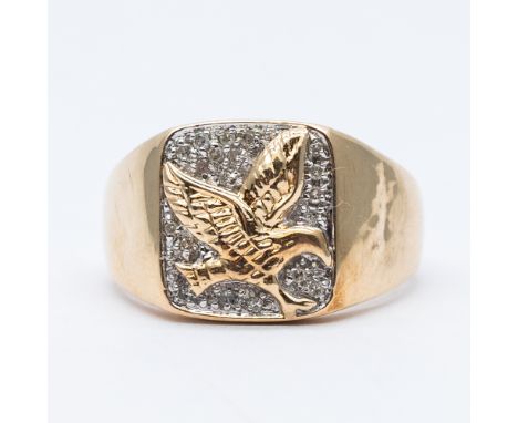 A 9ct yellow gold eagle design ring,
0.10ct diamonds,
size R,
2.7 grams approx weight