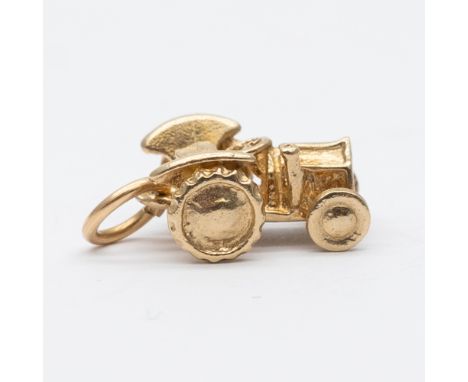 A 9ct yellow gold tractor charm ,
12mm x 10mm in size,
1.9 grams in weight approx