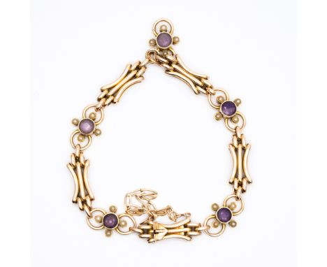 A 9ct yellow gold victorian gate bracelet,
set with amethyst and seed pearls,
7 inches in length,
12.5 grams in weight approx