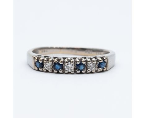 An 18ct white gold sapphire and diamond eternity ring,
approx 0.10ct diamonds approx 0.20ct sapphire,
size K,
2.2 grams in we