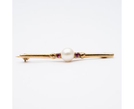 A 9ct yellow gold cultured pearl and ruby brooch,
5mm - 6mm pearl,
2x rubies,
gold pin,
45mm long ,
2.3 grams in weight appro