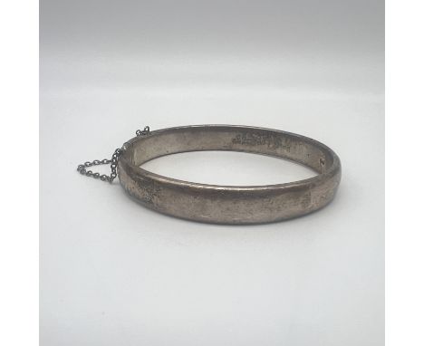 A vintage silver bangle, 18 grams in weight approx