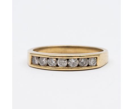 A 9ct yellow diamond channel set eternity ring,
3.3 grams in weight approx,
size R,
approx 0.50ct diamonds