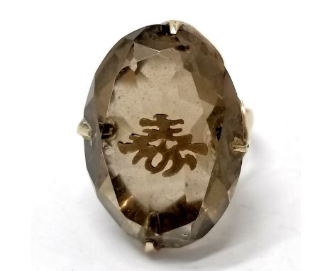 Unmarked gold (touch tests as 14ct) smoky quartz ring with pique gold Chinese character - size P &amp; 8.2g total weight 