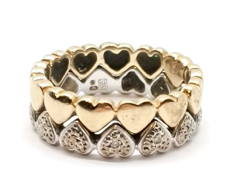 Pair of interlocking 9ct hallmarked gold rings with heart design - the white gold ring is set with 5 small diamonds - size N 