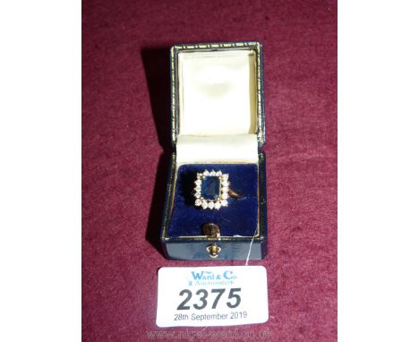 A gold Ring set with diamonds around central sapphire U.K. size "N", U.S. size "7 1/4", E.U. size "55".