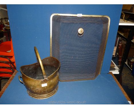 A Brass coal Scuttle and a fireguard.