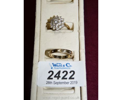 An eternity style ring set with twelve tiny white stones and marked within " 9 ct." and a 9 ct. gold 375 hallmarked cluster r