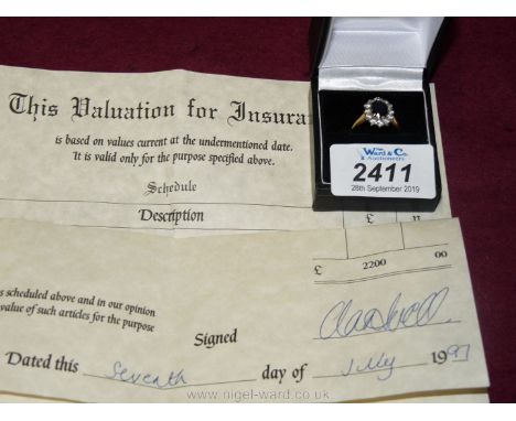An 18ct. sapphire and diamond cluster Ring, with insurance valuation.