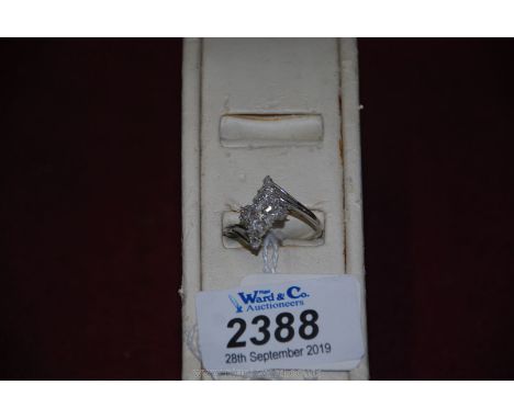 A silver Ring set with thirty diamond chips.