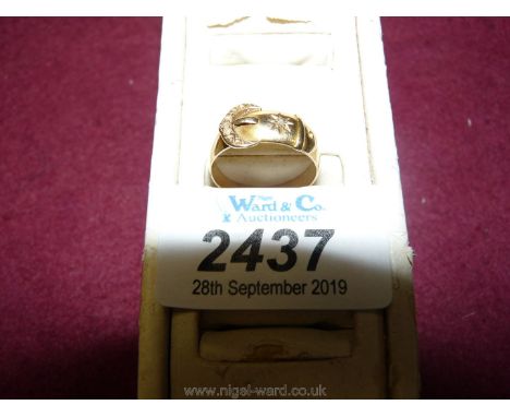 An 18 ct. gold belt and buckle Ring set with a chip diamond, 4 gms. approx.