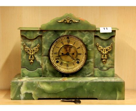 A 19th century brass dial onyx mantle clock, H. 29cm.