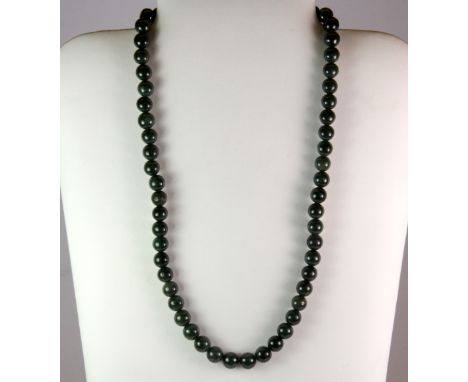 A lovely polished nephrite jade bead necklace, L. 60cm.