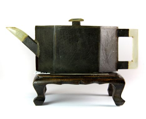 A lovely 19th century Chinese pewter overlaid terracotta tea pot with jade handle and spout, together with hardwood stand inl