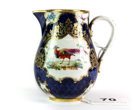 A small 19th century, possibly Worcester, porcelain sparrow beak jug, with 'C' scroll handle, decorated with an exotic bird o