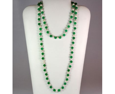 A necklace of polished jade beads and cultured pearls. Length 120cm.