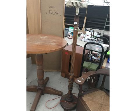 A CARVED MAHOGANY STANDARD LAMP 