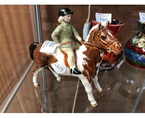 A BESWICK SKEWBALD HORSE AND RIDER CERAMIC FIGURE 