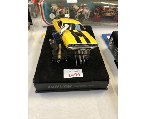 A DIE CAST MOUNTED 'DRIVER' DODGE CHALLENGER MODEL 