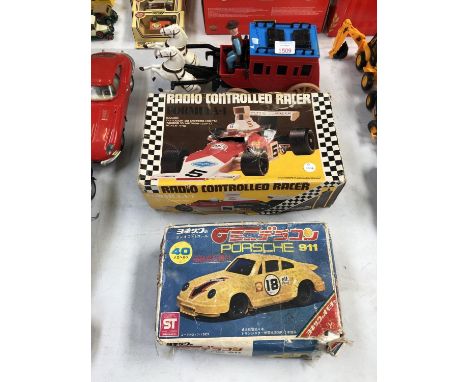 TWO BOXED REMOTE CONTROL CARS AND A STAGECOACH MODEL (3) 