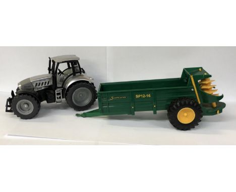 A 'SIKU' MODEL R8 265 LAMBORGINI TRACTOR MODEL WITH A SAMSON SP12-16 'BRITAINS' MUCK SPREADER, BOTH UNBOXED 