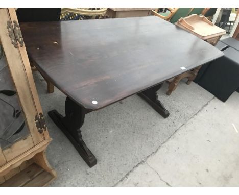 AN ERCOL ELM DINING TABLE 