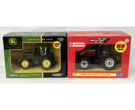 A BOXED 'BRITAINS' STEYR 6135 TRACTOR MODEL AND A 'JOHN DEERE' 5410 MODEL (2) 