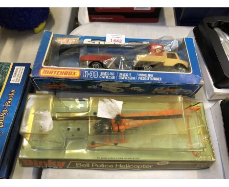 A MATCHBOX K-30 DIE CAST MODEL AND A 'DINKY' BELL POLICE HELICOPTER 